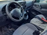 a small car with a steering wheel and a bag in the passenger seat