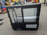 an image of a refrigerated display case in a warehouse