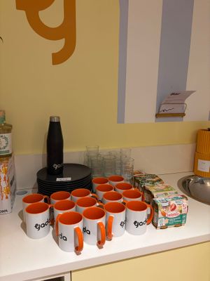 many cups of coffee on the counter in the kitchen