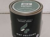 a can of paint sitting on a counter top