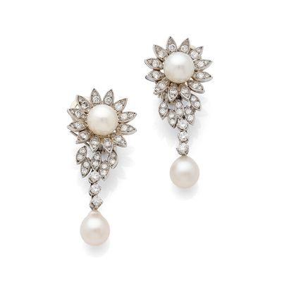a pair of pearl and diamond earrings