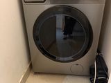 a washer and dryer in the corner of a room