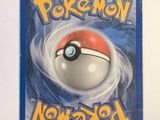 a pokemon trading card with a red ball on it