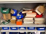 many boxes and boxes on the shelves in the closet