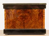 a small wooden box with a lid on a table