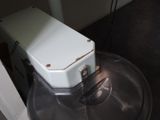 a machine that is sitting on top of a metal bowl