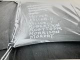 a black and white photo of a tent with writing on it
