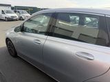 a silver car that is parked in a parking lot