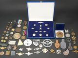 a box full of medals and other items on a table