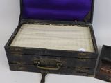 a small wooden box with a purple cover and a small wooden box with a purple cover