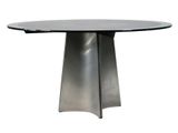 a close up of a table with a metal base and a glass top