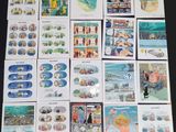 a lot of postcards with pictures of people on them