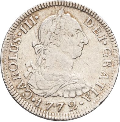 gros plan d'une pièce de monnaie sur fond blanc
