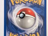 a close up of a pokemon card on a white surface