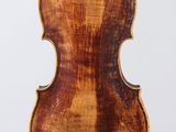 an old violin with a wooden back and a wooden bow
