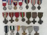 several medals and medals are arranged on a white surface