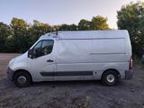 a white van that is parked in a parking lot