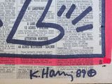 a picture of a newspaper with a handwritten line on it