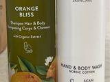 a bottle of hand and body wash next to a tube of hand and body wash