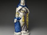 l'image d'une statue représentant une femme tenant un enfant dans ses bras