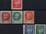 a close up of a group of stamps on a black surface