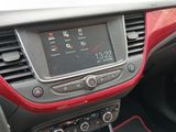 the dashboard of a car with a digital clock on the dash