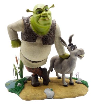 statue of a man and a donkey on a small island