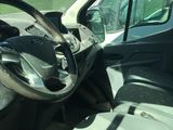 a view of the inside of a vehicle from the driver ' s seat