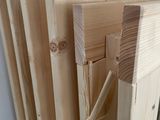many pieces of wood stacked on top of each other