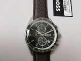 the watch has a brown leather strap and a black face