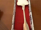 a box with a spoon and a fork inside of it