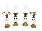 three white and gold owl lamps on a white background with a white background