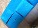 a close up of a toilet with a blue seat cover