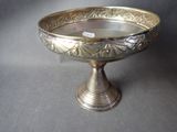 a silver bowl with a silver lid on a table