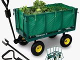 une charrette verte remplie de laitues et d'outils de jardinage