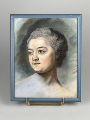 portrait of a woman in a blue dress by an easel