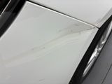 a close up of a car ' s door handle and the door handle is missing