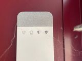 an image of a smart device on a red door