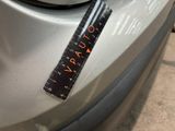 a close up of a car with a ruler on the front of it