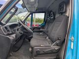 a blue van with two seats in the back of it