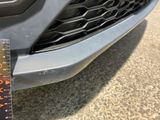 a close up of a car ' s front grill with a ruler on it