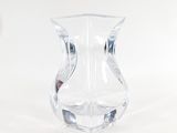 a clear glass vase sitting on a white surface