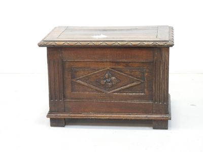 a small wooden box with a glass top on a white surface