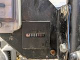 a close up of a meter on the side of a motorcycle