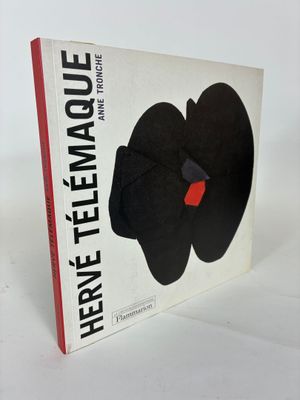 an image of a book with a black flower on it