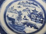 two plates with blue and white designs on them
