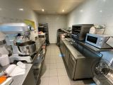 a kitchen with a lot of counter space and a lot of appliances