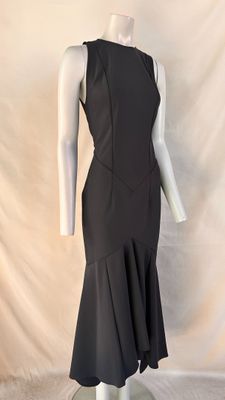 the back of a black dress on a mannequin mannequin mannequin mannequin mann