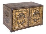 an ornately decorated chest with two doors and two drawers