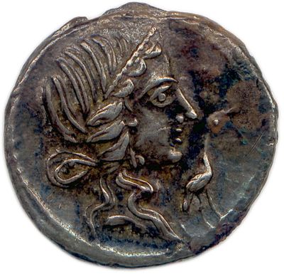 une pièce de monnaie en argent portant un visage de femme